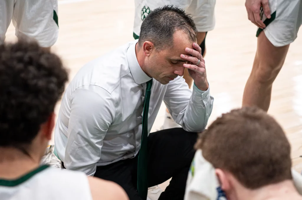 Northwest men's basketball coach Ben McCollum collects his composure.