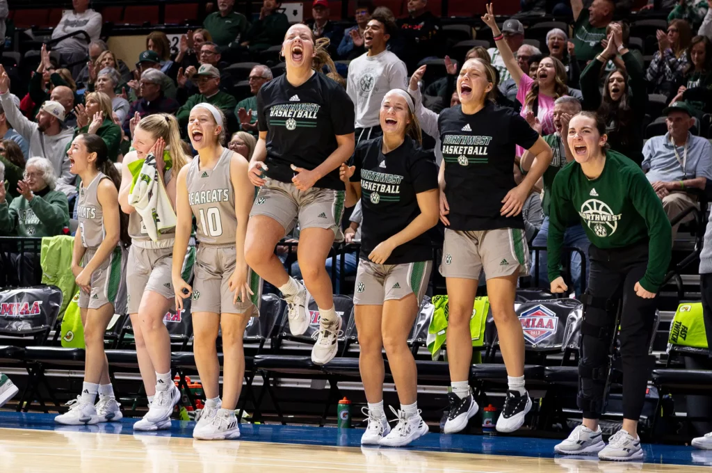 The Bearcat women's basketball team celebrates during the MIAA Tournament Quarterfinals.