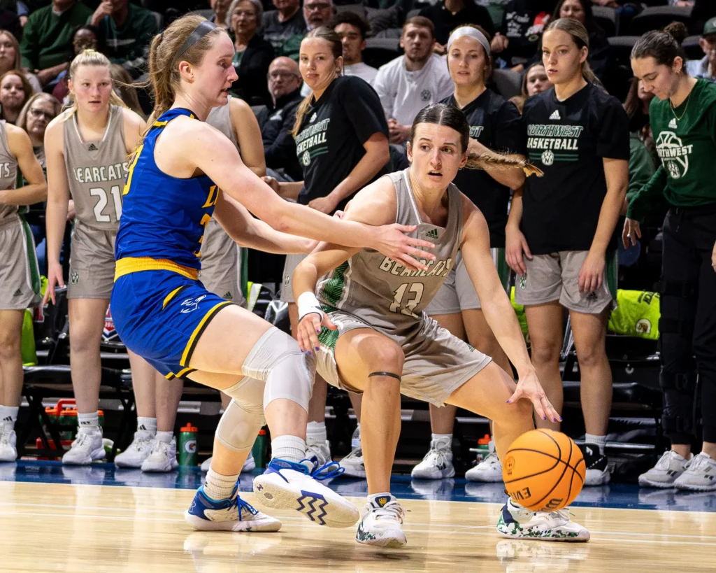 Bearcat women's basketball guard Caely Kesten dribbles along the baseline during the MIAA Tournament Quarterfinals.