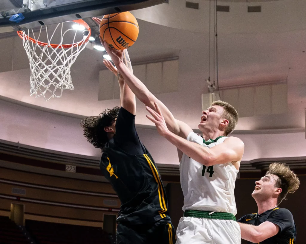 Bearcat men's basketball guard Bennett Stirtz scores a layup during the MIAA Tournament Quarterfinals.