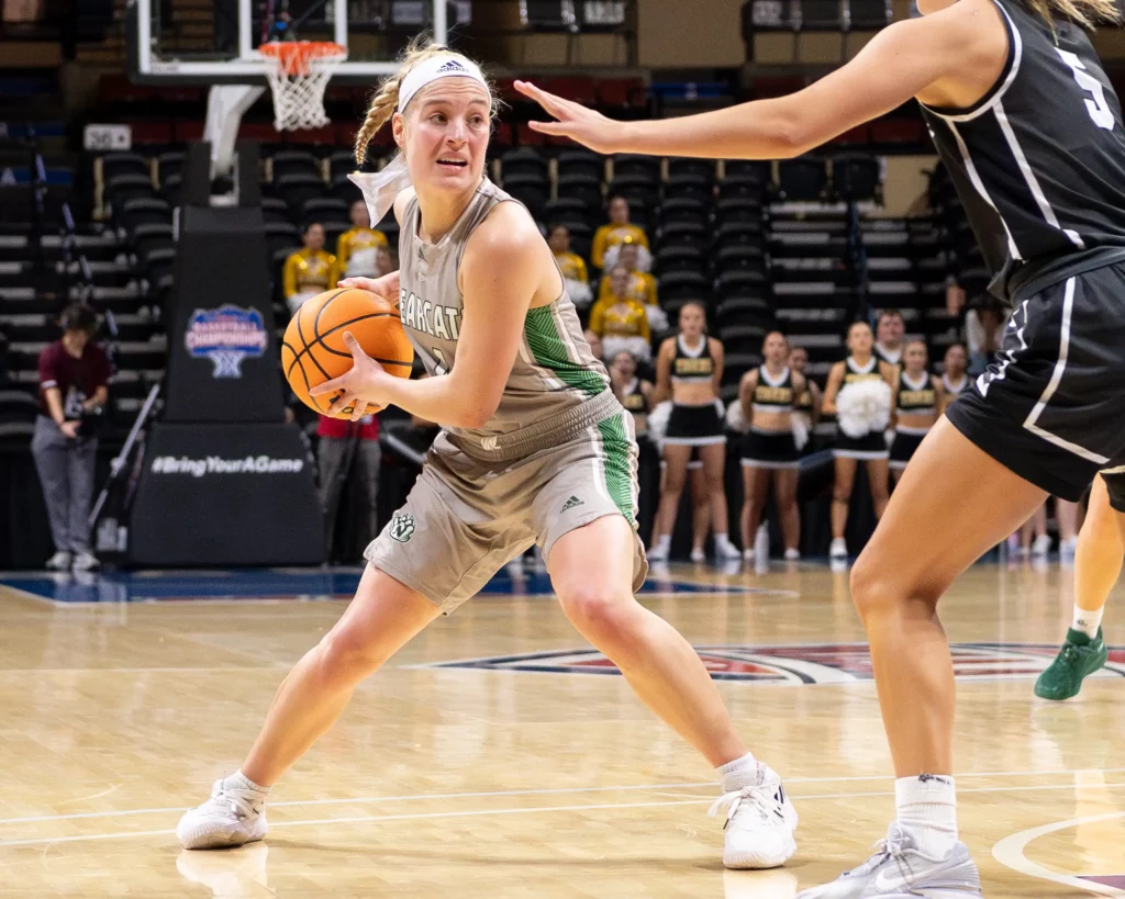 Bearcat women's basketball guard Lindsey Kelderman looks for a teammate during the MIAA Tournament Semifinals.