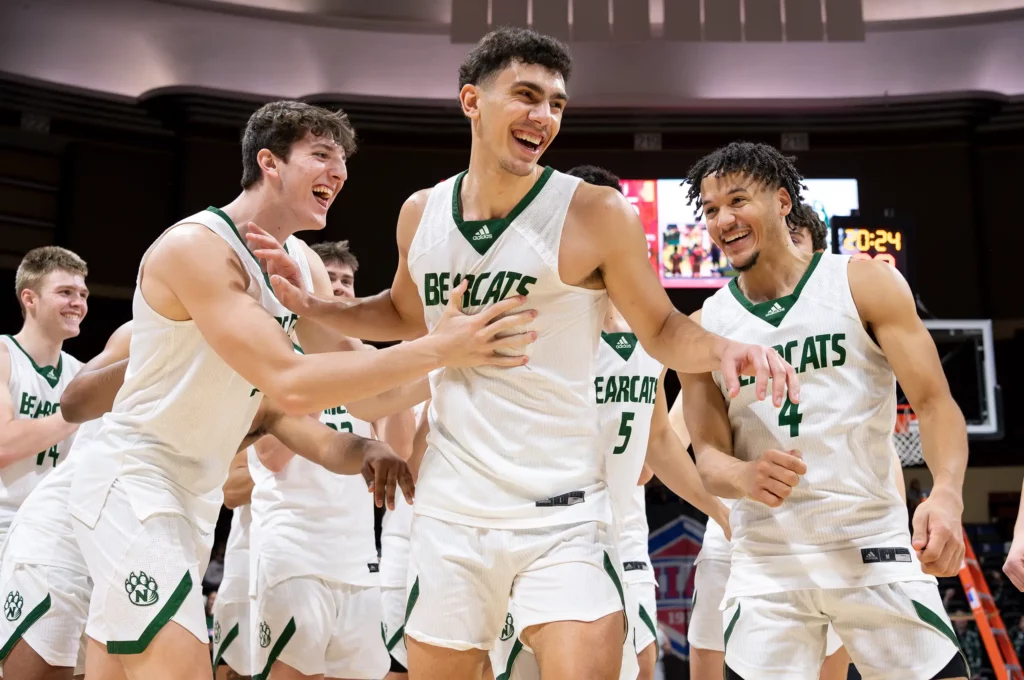 Bearcat men's basketball forward Daniel Abreu celebrates after earning MVP of the MIAA Tournament.