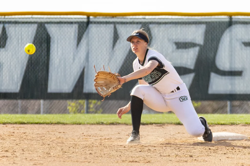 Bearcat softball infielder Annie Gahan catches a line drive.