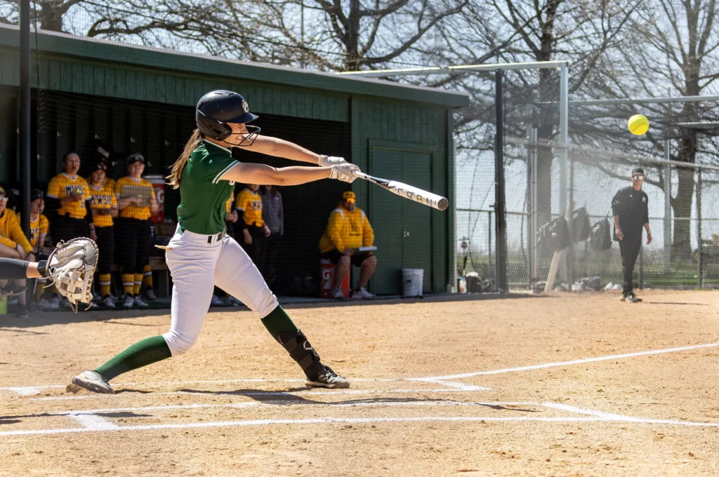 Bearcat softball catcher/outfielder Lauren Gray hits the ball.