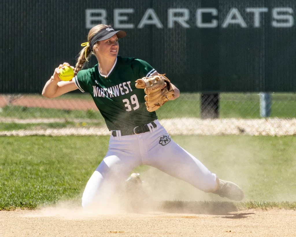 Bearcat softball infielder Annie Gahan looks to hurl a groundball to second base.