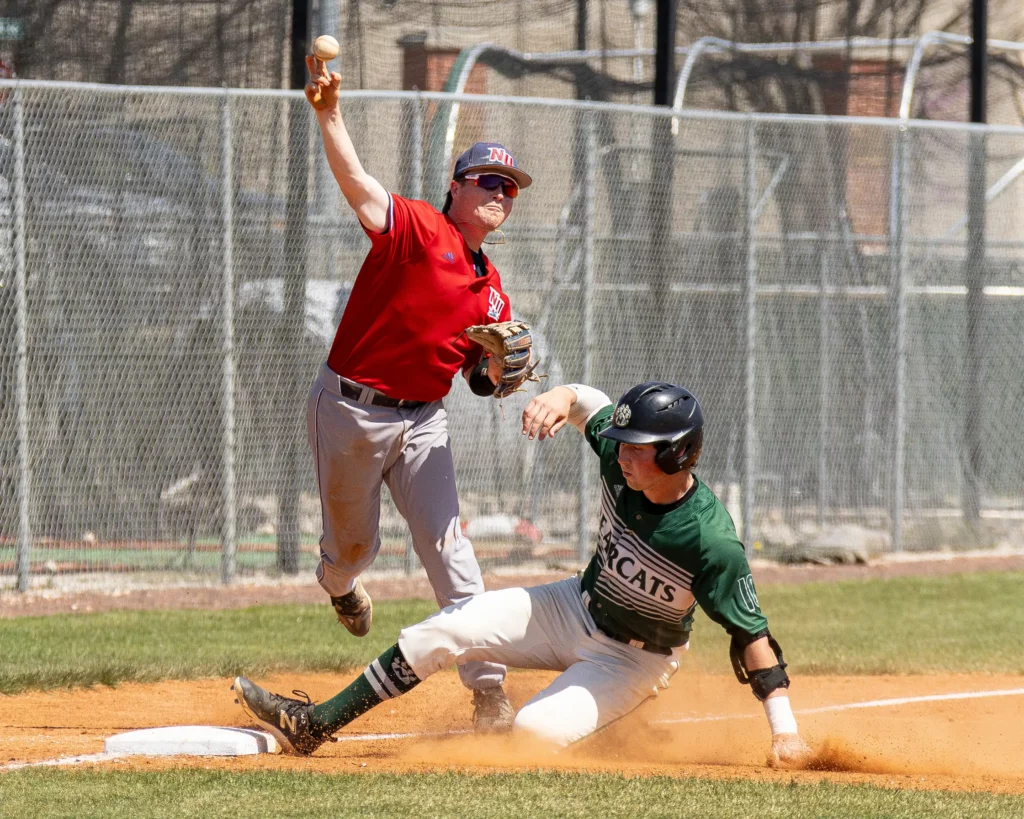 Bearcat baseball utility Ryan Williams safely slides into third base during a loss against Newman.