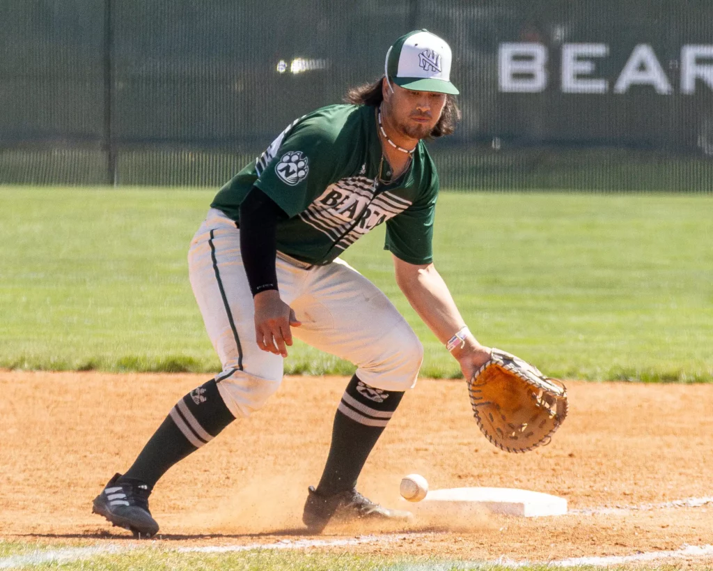 Bearcat baseball infielder Kaehukai Young fields a ground ball.