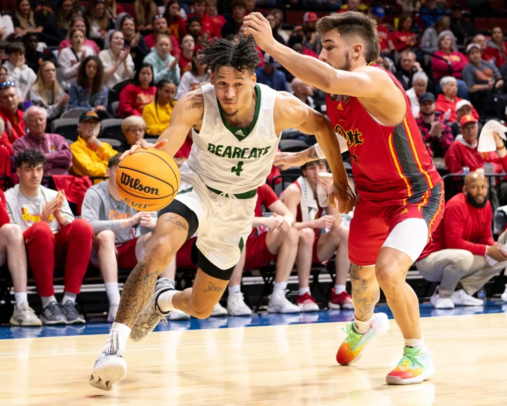 Bearcat men's basketball guard Isaiah Jackson dribbles along the baseline during the MIAA Tournament Championship.