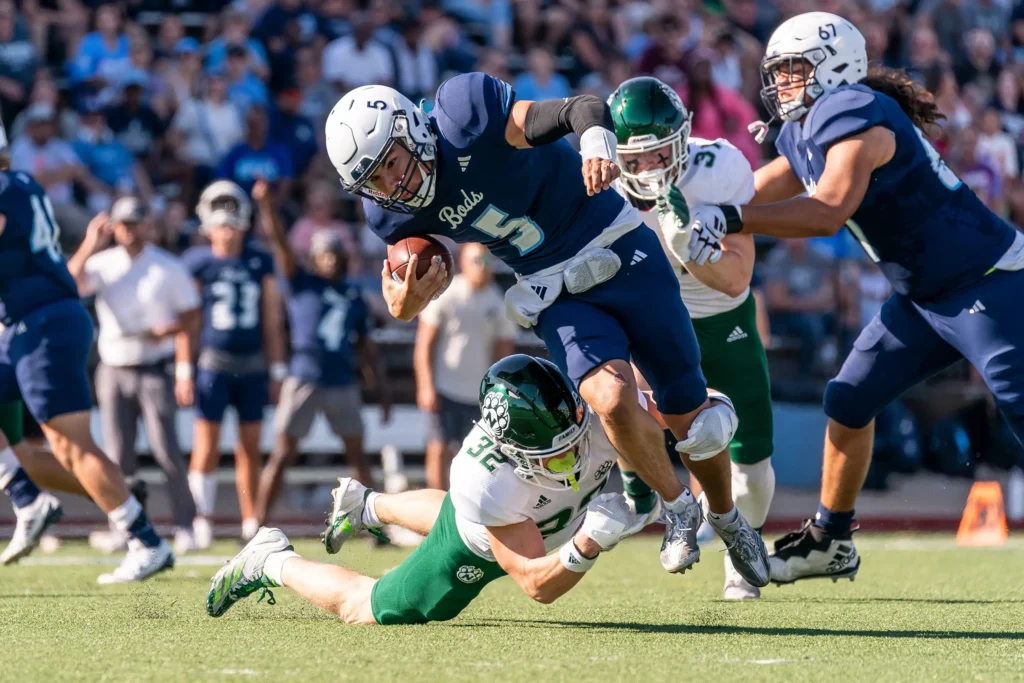 Bearcat football defensive back Shane Fredrickson tackles a Washburn University opponent.